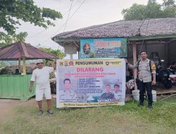 Bhabinkamtibmas Desa Lebani Pasang Baligho Himbauan